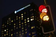 A traffic light is pictured in front of the Intercontinental hotel where nuclear negotiations between Iran and policymakers from six major powers are taking place, in Geneva November 23, 2013. REUTERS/Denis Balibouse