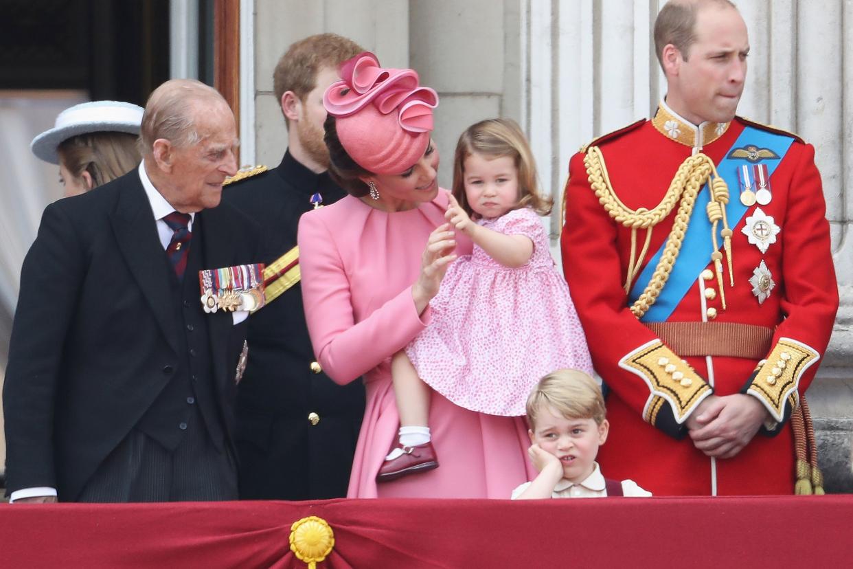 Prince Philip, Duke of Edinburgh, Prince Harry, Catherine, Duchess of Cambridge, Princess Charlotte of Cambridge, Prince George of Cambridge and Prince William, Duke of Cambridge look out from the balcony of Buckingham Palace during the Trooping the Colou