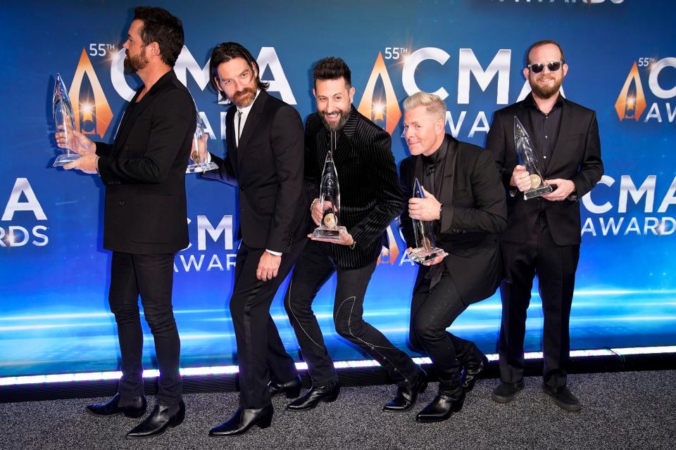 Old Dominion celebrate with their awards for Group of the Year during the 55th CMA Awards at Bridgestone Arena Wednesday, Nov. 10, 2021 in Nashville, Tenn.