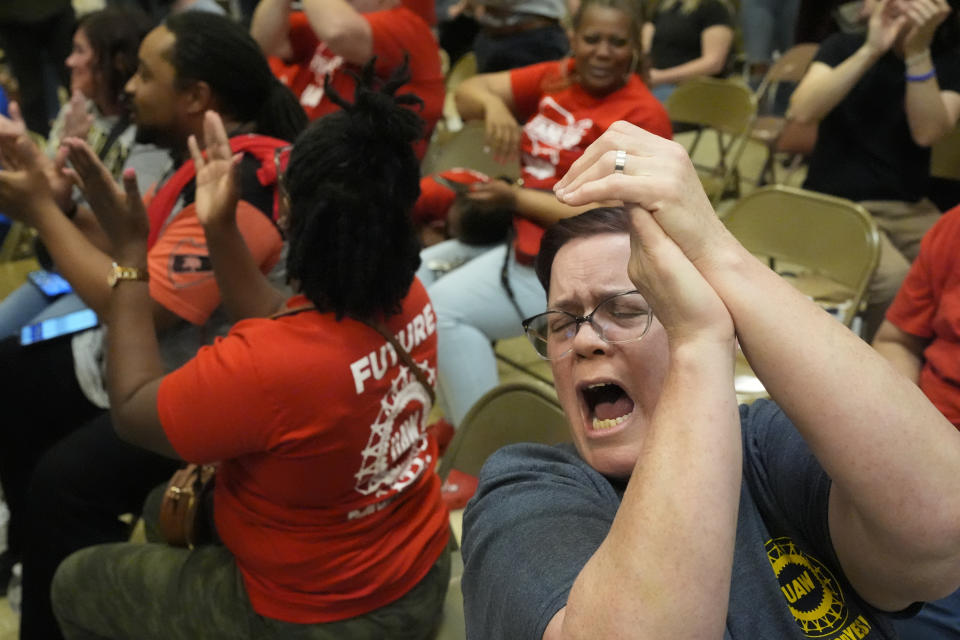 Volkswagen automobile plant employees celebrate after they voted to join the UAW union Friday, April 19, 2024, in Chattanooga, Tenn. (AP Photo/George Walker IV)