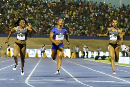 Athletics - Jamaica National Racers Grand Prix - Kingston - 11/06/16 Barbara Pierre of the U.S. (L), winner Shelly Ann Fraser Pryce of Jamaica (C) and Carmelita Jeter of the U.S. in action during women's 100m race. REUTERS/Gilbert Bellamy