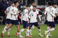 U.S. forward Christian Pulisic (10) celebrates with teammate Tyler Adams (4) after scoring a goal during the second half of a FIFA World Cup qualifying soccer match against Mexico, Friday, Nov. 12, 2021, in Cincinnati. (AP Photo/Jeff Dean)