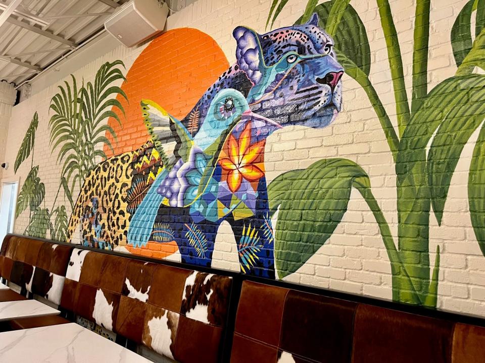 The hand-painted murals pop against the white brick walls at Casa Blanca in Fort Myers.