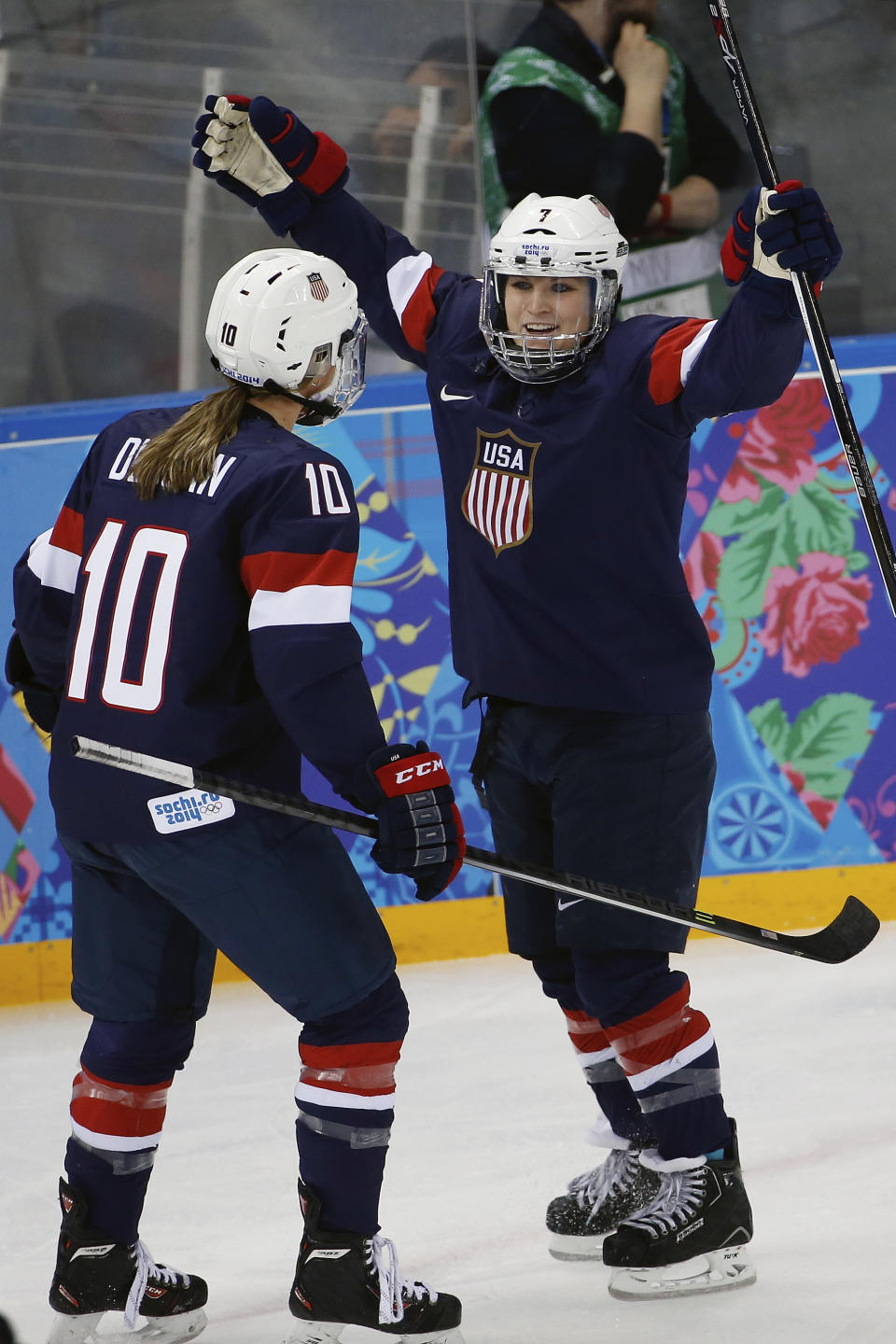 Monique Lamoureux of the Untied States celebrates her goal against Switzerland with teammate Meghan Duggan of the Untied States during the first period of the 2014 Winter Olympics women's ice hockey game at Shayba Arena, Monday, Feb. 10, 2014, in Sochi, Russia. (AP Photo/Petr David Josek)