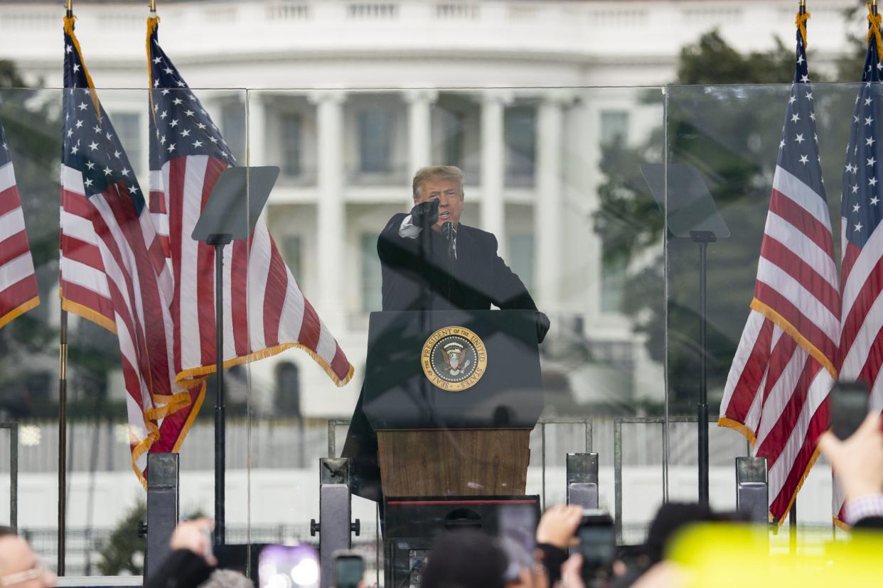 Then-President Donald Trump speaks during a rally protesting the electoral college certification of Joe Biden as President in Washington. 