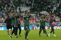 Saudi Arabia players applaud fans at the end of the World Cup group C soccer match between Poland and Saudi Arabia, at the Education City Stadium in Al Rayyan , Qatar, Saturday, Nov. 26, 2022. (AP Photo/Francisco Seco)