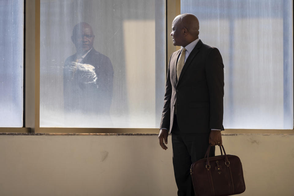 John Nkengasong, director of the Africa Centers for Disease Control and Prevention, walks in the organization's headquarters in Addis Ababa, Ethiopia Tuesday, Sept. 15, 2020. The coronavirus pandemic has fractured global relationships, but as Africa's top public health official, Nkengasong has helped to steer the continent's 54 countries into an alliance that has won praise as responding better than some richer nations. (Mulugeta Ayene via AP)