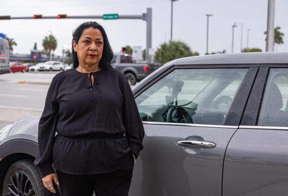 Cary Campria poses for a photo in front of West Flagler Street in July 2023. She was driving down that street when a man got out to yell at her at a stop light. Lauren Witte/lwitte@miamiherald.com