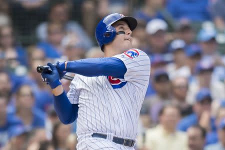 Aug 15, 2018; Chicago, IL, USA; Chicago Cubs first baseman Anthony Rizzo (44) hits an RBI single during the fourth inning against the Milwaukee Brewers at Wrigley Field. Mandatory Credit: Patrick Gorski-USA TODAY Sports