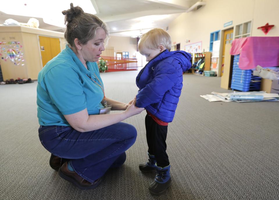 Lora Meverden helps Russell Roushia, 3, with his coat before heading outside to play Monday, February 26, 2024, at the YMCA Child Learning Center in Appleton, Wis. Appleton 
Dan Powers/USA TODAY NETWORK-Wisconsin.