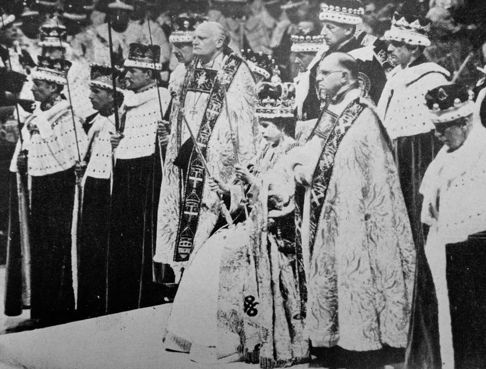 H.M. the Queen wearing St. Edward's Crown and holding the Royal Sceptre and the Rod of Equity, waits to receive the homage of her peers after her Coronation. (Photo by: Universal History Archive/Universal Images Group via Getty Images)