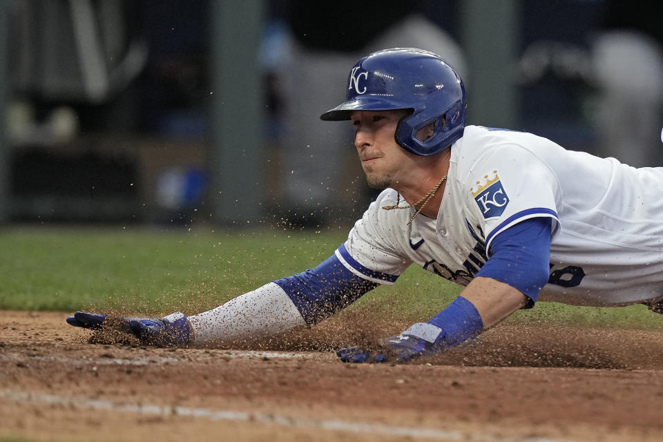 Kansas City Royals' Drew Waters slides home to score on a single by Dairon Blanco during the fourth inning of a baseball game against the Detroit Tigers Tuesday, July 18, 2023, in Kansas City, Mo. (AP Photo/Charlie Riedel)