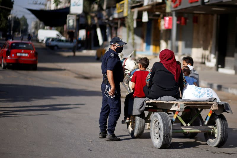 Gaza reports first COVID-19 cases outside quarantine areas, declares lockdown