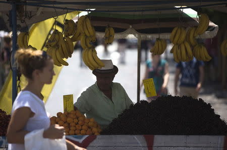 A street vendor sells fruits in Monastiraki square in central Athens, Greece July 22, 2015. REUTERS/Ronen Zvulun