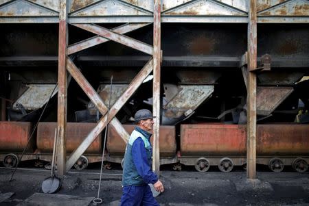 A miner walks near a coal mine entrance near Kakanj, Bosnia and Hercegovina October 13, 2015. REUTERS/Dado Ruvic