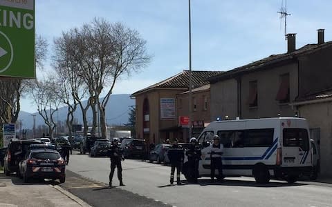 Armed police outside the supermarket on Friday morning - Credit: REUTERS