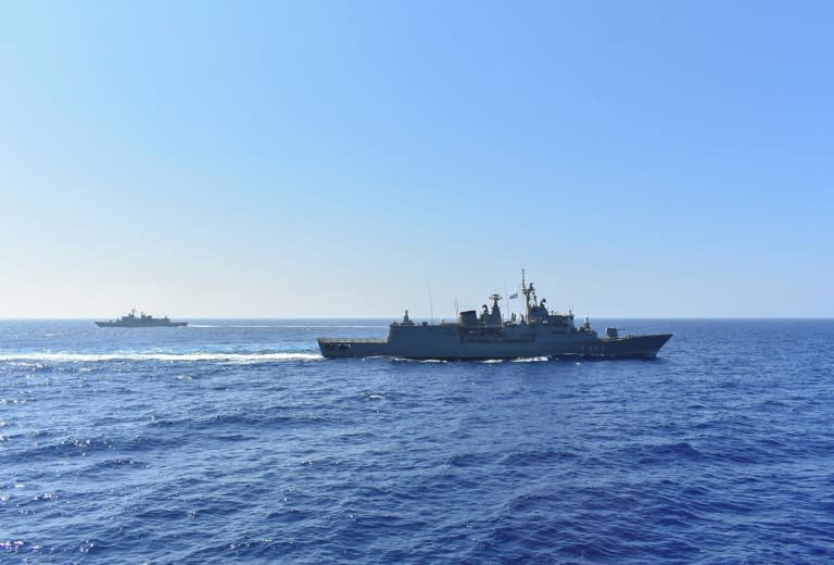 A handout photo released by the Greek National Defence Ministry on August 26, 2020 shows Greek Hydra-class frigate Spetsai (F-453) of the Hellenic Navy (front) and another ship taking part in a military exercise in the eastern Mediterranean Sea, on August 25, 2020. Greece said it will launch military exercises on August 25 with France, Italy and Cyprus in the eastern Mediterranean, the focus of escalating tensions between Athens and Ankara. The joint exercises south of Cyprus and the Greek island of Crete will last three days, the defence ministry said. The discovery of major gas deposits in waters surrounding Crete and Cyprus has triggered a scramble for energy riches and revived old rivalries between NATO members Greece and Turkey. (Handout)