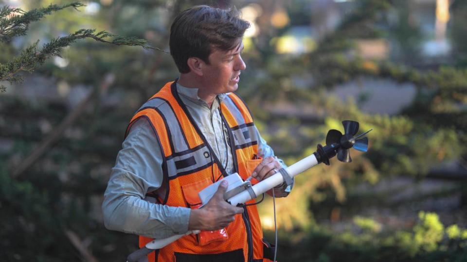 Kyle Nessen, a Cal Poly grad student, is studying wind movement at the Pismo State Beach Monarch Butterfly Grove to help scientists and land managers better understand and protect the imperiled species, seen here on Nov. 29, 2023.