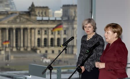 German Chancellor Angela Merkel and Britain's Prime Minister Theresa May address the media prior to a meeting at the chancellery in Berlin, Germany, November 18, 2016. REUTERS/Michael Sohn/Pool
