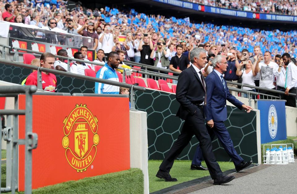 Football Soccer Britain - Leicester City v Manchester United - FA Community Shield - Wembley Stadium - 7/8/16 Manchester United manager Jose Mourinho and Leicester City manager Claudio Ranieri lead Wayne Rooney, Wes Morgan and their teams out before the game Reuters / Eddie Keogh Livepic EDITORIAL USE ONLY. No use with unauthorized audio, video, data, fixture lists, club/league logos or "live" services. Online in-match use limited to 45 images, no video emulation. No use in betting, games or single club/league/player publications. Please contact your account representative for further details.