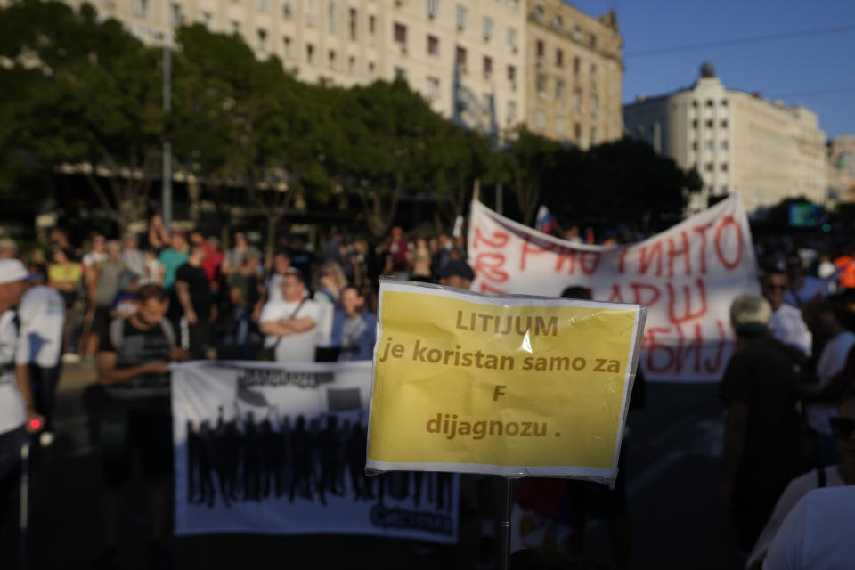 People attend a protest against pollution and the exploitation of a lithium mine in the country, in Belgrade, Serbia, Saturday, Aug. 10, 2024. Thousands were gathering Saturday at a rally against lithium mining in Serbia despite government warnings of alleged planned unrest designed to topple the government of populist President Aleksandar Vucic. The banner reads 'lithium is good only for F diagnosis' in Serbian. (AP Photo/Darko Vojinovic)