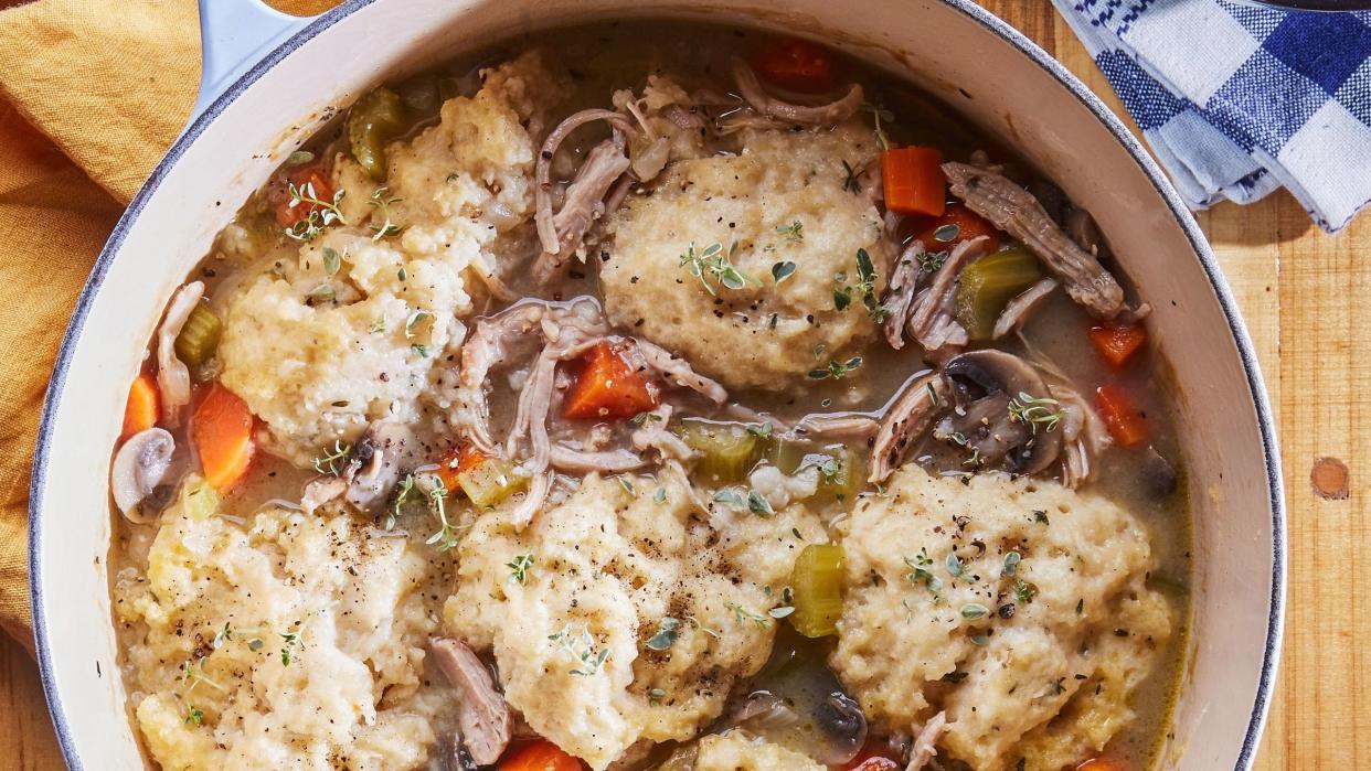 easy weeknight chicken and dumplings in a light blue dutch oven