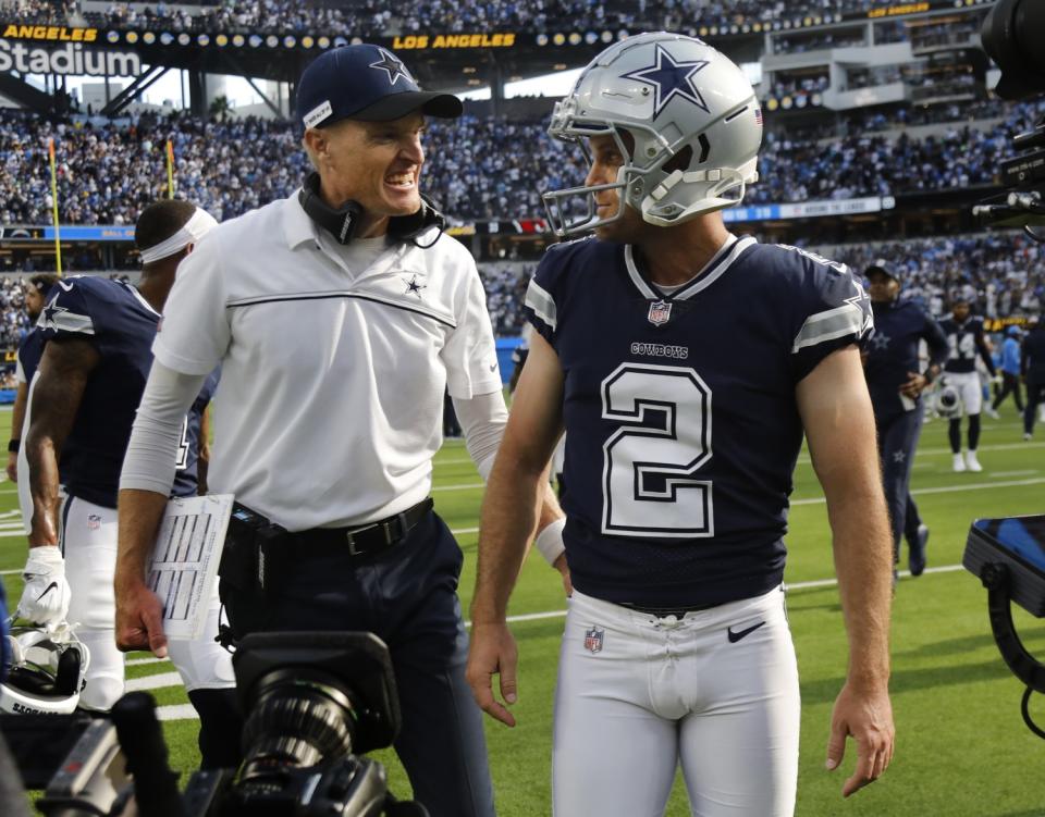 Dallas Cowboys special teams coordinator John Fassel congratulates Dallas Cowboys kicker Greg Zuerlein.