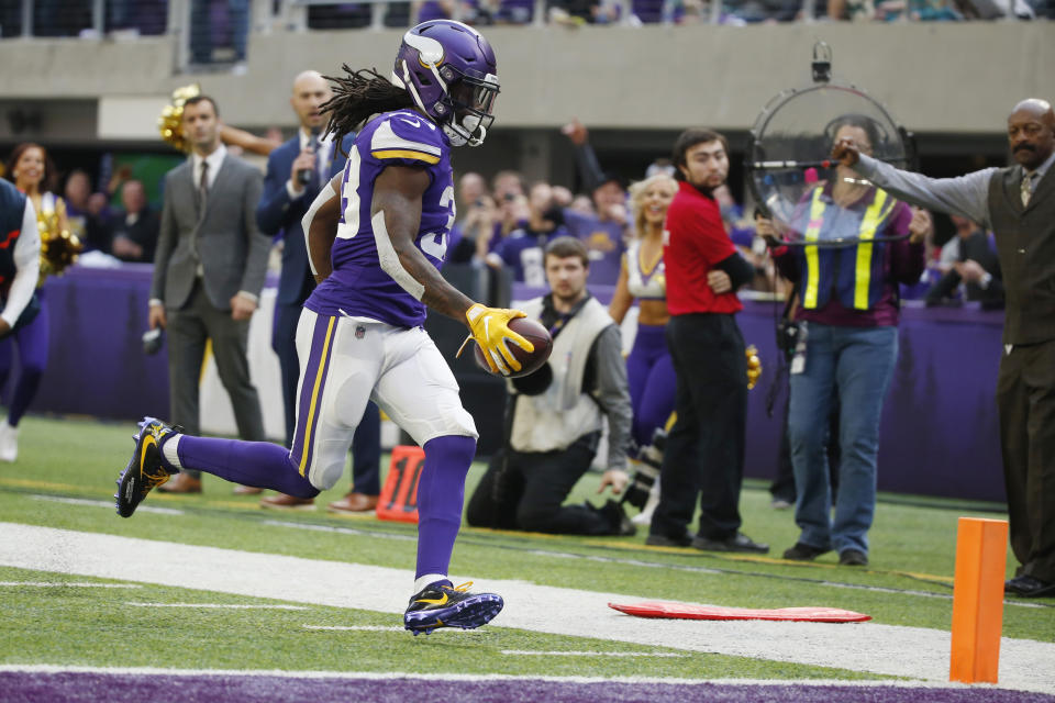 Minnesota Vikings running back Dalvin Cook scores on a 13-yard touchdown run in the first half of an NFL football game against the Miami Dolphins, Sunday, Dec. 16, 2018, in Minneapolis. (AP Photo/Bruce Kluckhohn)