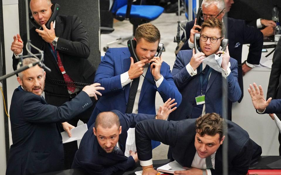 Traders in the Ring at the London Metal Exchange in the City of London - Yui Mok/PA Wire