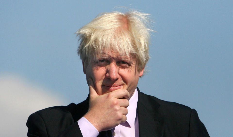 Boris Johnson watch as the Olympic, Paralympic and British flags are raised outside City Hall in London to formally mark London becoming the host city for the 2012 Olympic and Paralympic Games.