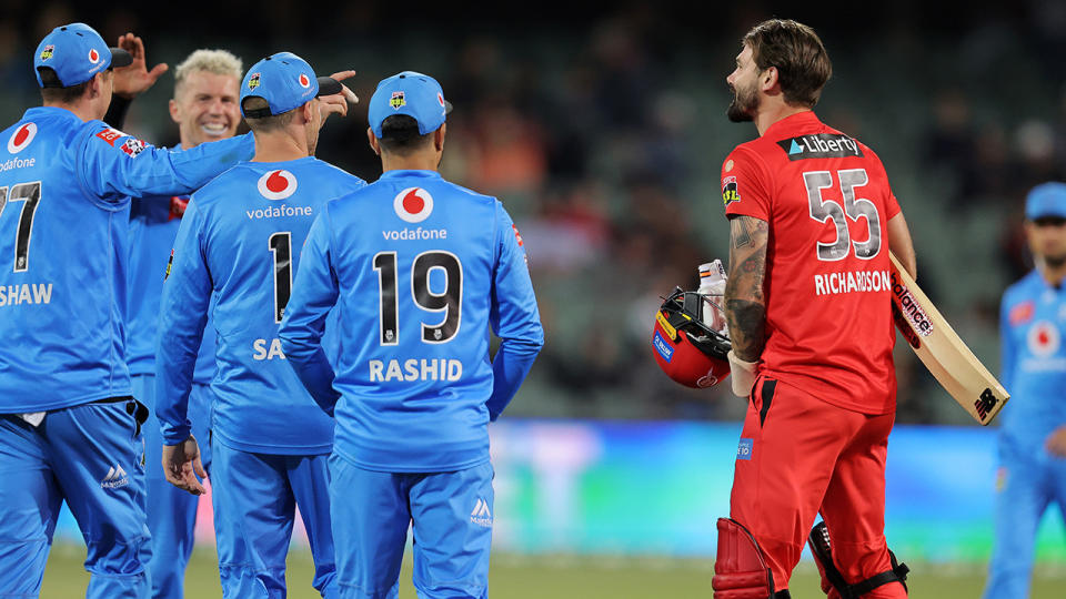 Kane Richardson has words with the Adelaide Strikers after losing his wicket. (Photo by Daniel Kalisz/Getty Images)