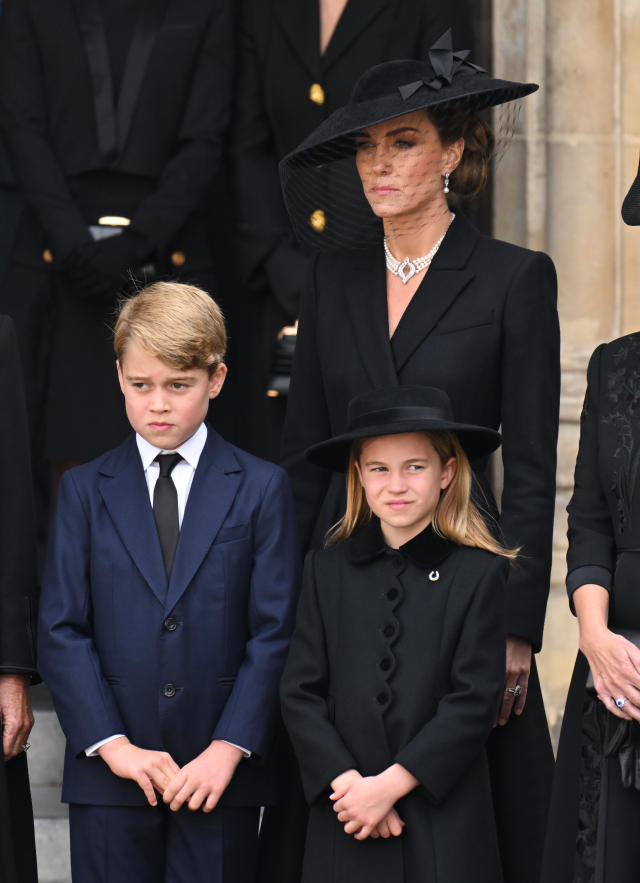 LONDON, ENGLAND - SEPTEMBER 19: Prince George of Wales, Catherine, Princess of Wales and Princess Charlotte of Wales during the State Funeral of Queen Elizabeth II at Westminster Abbey on September 19, 2022 in London, England. Elizabeth Alexandra Mary Windsor was born in Bruton Street, Mayfair, London on 21 April 1926. She married Prince Philip in 1947 and ascended the throne of the United Kingdom and Commonwealth on 6 February 1952 after the death of her Father, King George VI. Queen Elizabeth II died at Balmoral Castle in Scotland on September 8, 2022, and is succeeded by her eldest son, King Charles III. (Photo by Karwai Tang/WireImage)