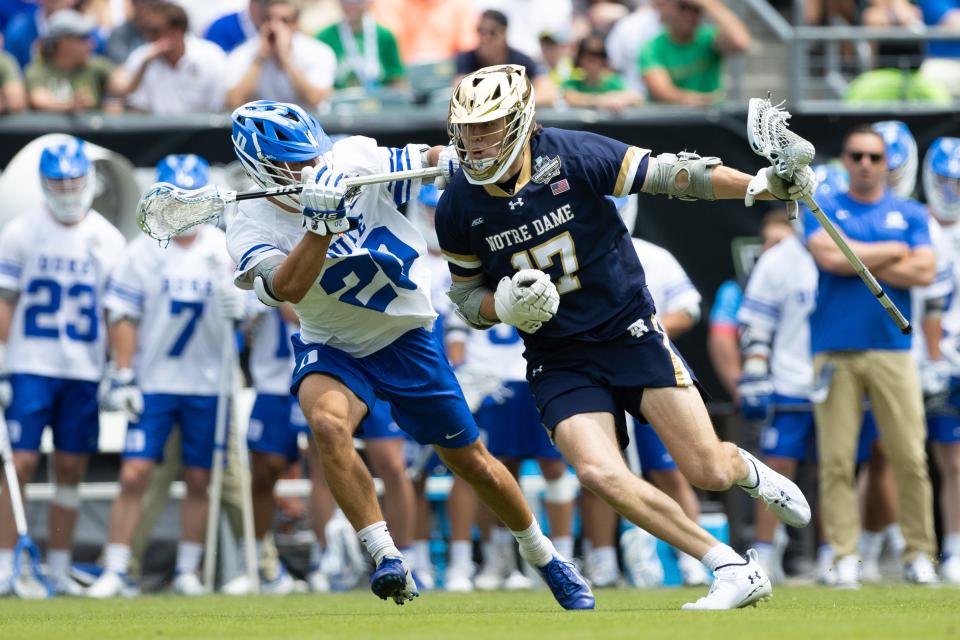 Notre Dame's Reilly Gray (17) controls the ball against Duke's Jack Gray (20) during the first quarter of the NCAA men's lacrosse championship game at Lincoln Financial.