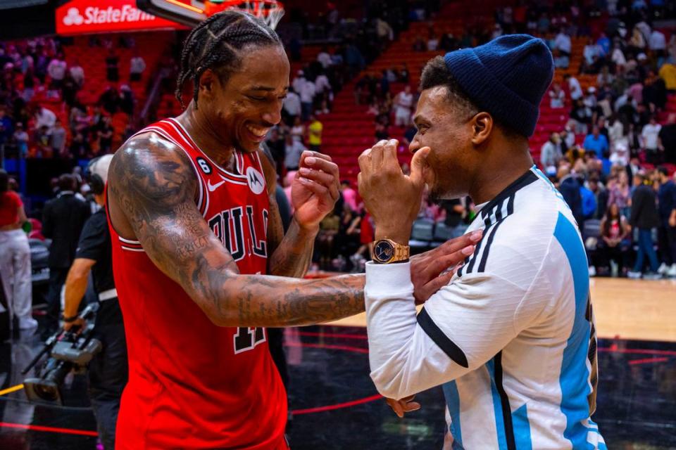Chicago Bulls forward DeMar DeRozan (11) interacts with Miami Heat point guard Kyle Lowry (7) after the second half of an NBA game at FTX Arena in Downtown Miami, Florida, on Tuesday, December 20, 2022. Chicago defeated Miami 113-103.