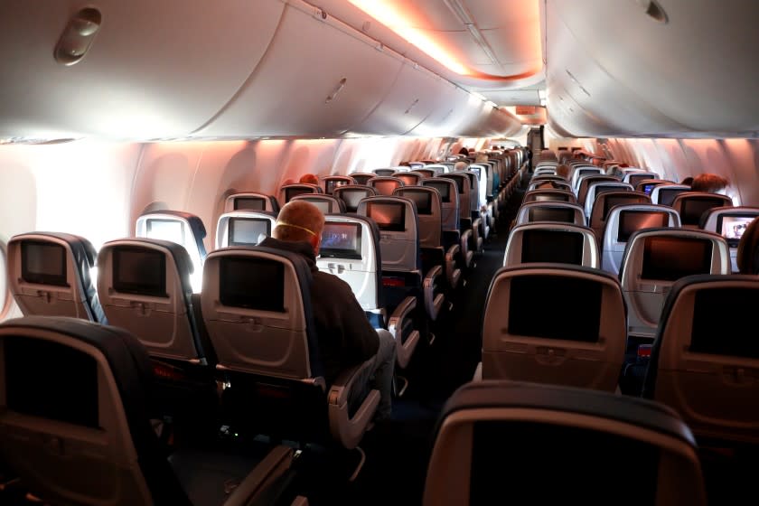 IN FLIGHT - APRIL 20: Passengers are seen in a cabin mid-flight on a Baltimore, Maryland bound Delta flight from Hartsfield-Jackson Atlanta International Airport on April 20, 2020 in Atlanta, Georgia. The airline industry has been hit hard by the COVID-19 pandemic, forcing the cancellation and consolidation of flights across the globe. (Photo by Rob Carr/Getty Images)