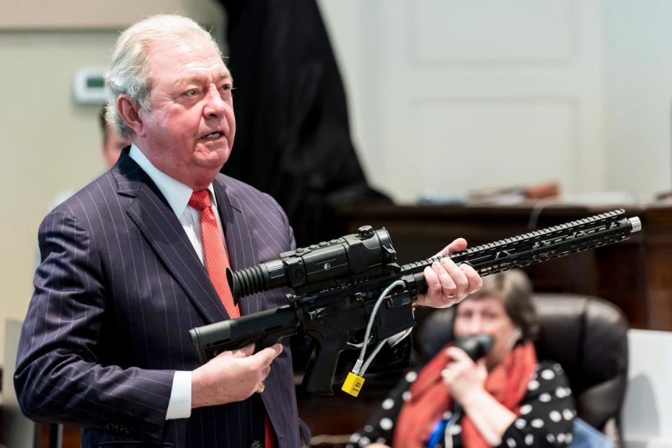 Defence attorney Dick Harpootlian holds Buster Murdaugh’s .300 Blackout rifle during Alex Murdaugh’s murder trial (Jeff Blake)