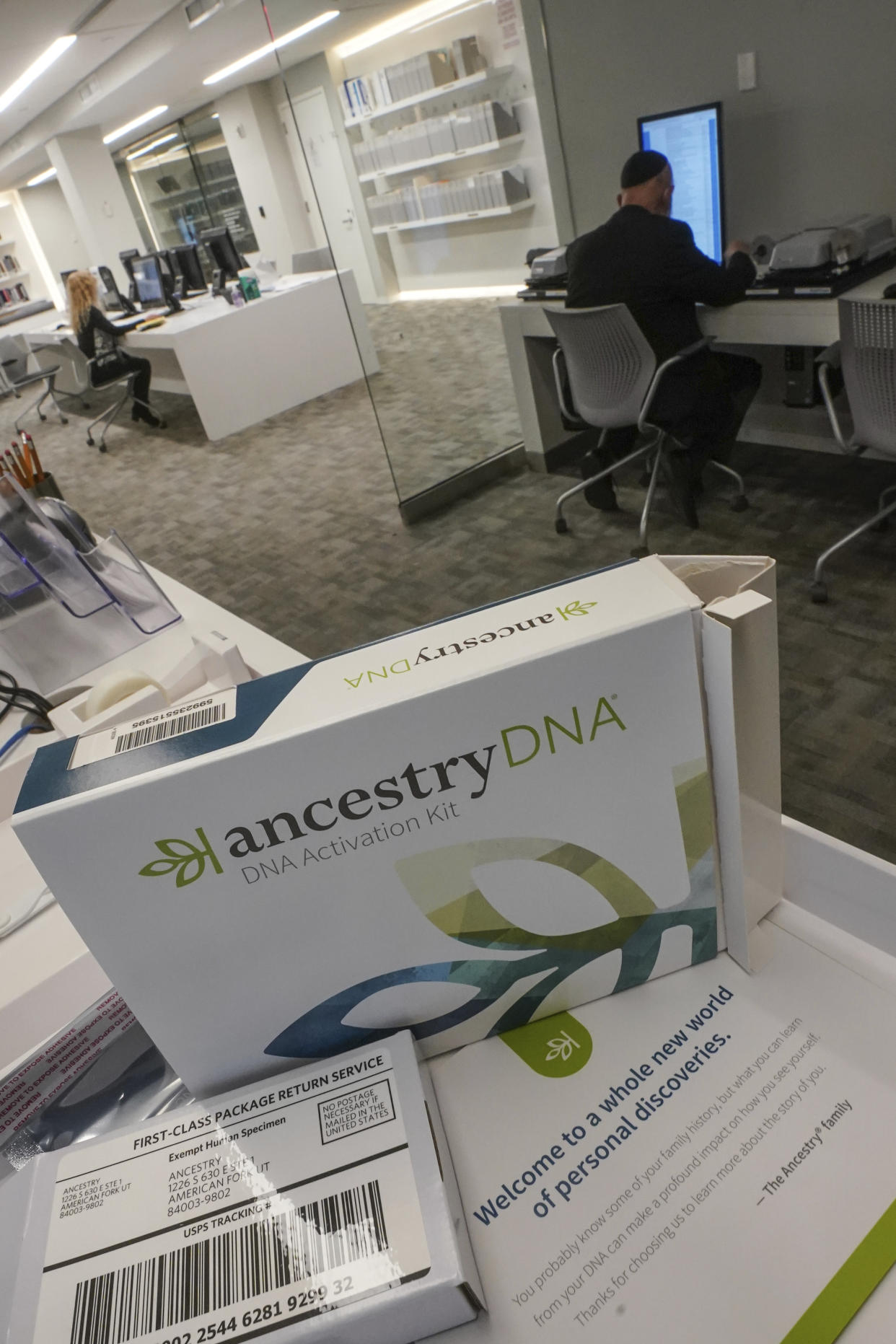 A genealogy testing kit for Ancestry/DNA is displayed in the Ackman and Ziff Family Genealogy Institute research area at the Center for Jewish History (CJH), Tuesday Nov. 29, 2022, in New York. CJH is launching a project offering the DNA testing kits for free to Holocaust survivors and their children to help increase the possibly of finding family connections torn apart in World War II. (AP Photo/Bebeto Matthews)