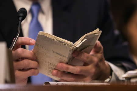 Supreme Court nominee Brett Kavanaugh holds his pocket size United States Constitution during the third day of his confirmation hearing before the Senate Judiciary Committee on Capitol Hill in Washington, U.S., September 6, 2018. REUTERS/Alex Wroblewski