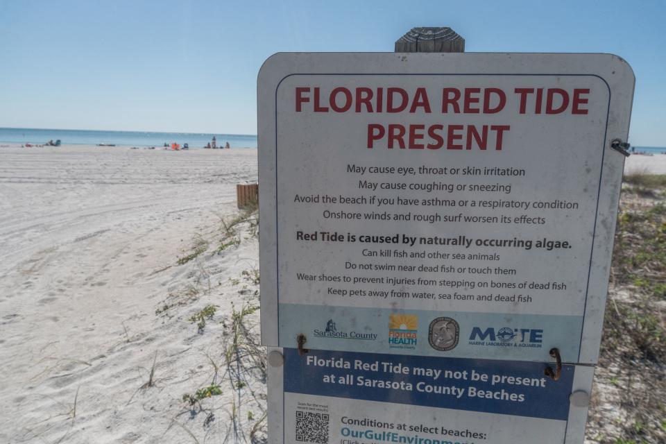 A red tide warning at Lido Key Beach in Sarasota, Fla.