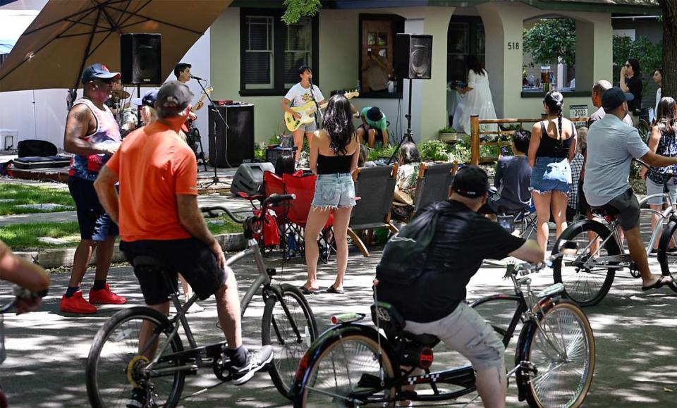 People listen to Sorry Machine during Modesto Porchfest in Modesto, Calif., Sunday, May 21, 2023.