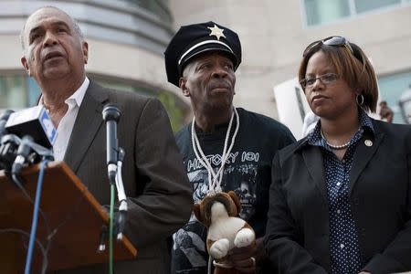 Zaki Baruti of the Universal African Peoples Organization (L), Anthony Shahid of the Tauheed Youth Group, and Missouri State Senator Jamilah Nasheed speak with the media outside the St. Louis County Justice Center in Clayton, Missouri, August 21, 2014. REUTERS/Mark Kauzlarich