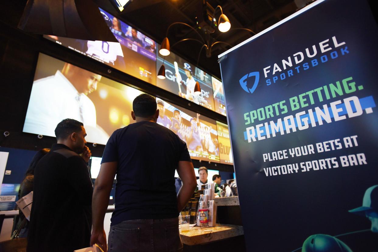 Fans watch TV screens during a game viewing party for fans at the FanDuel Sportsbook at Meadowlands Racing & Entertainment in East Rutherford, New Jersey.