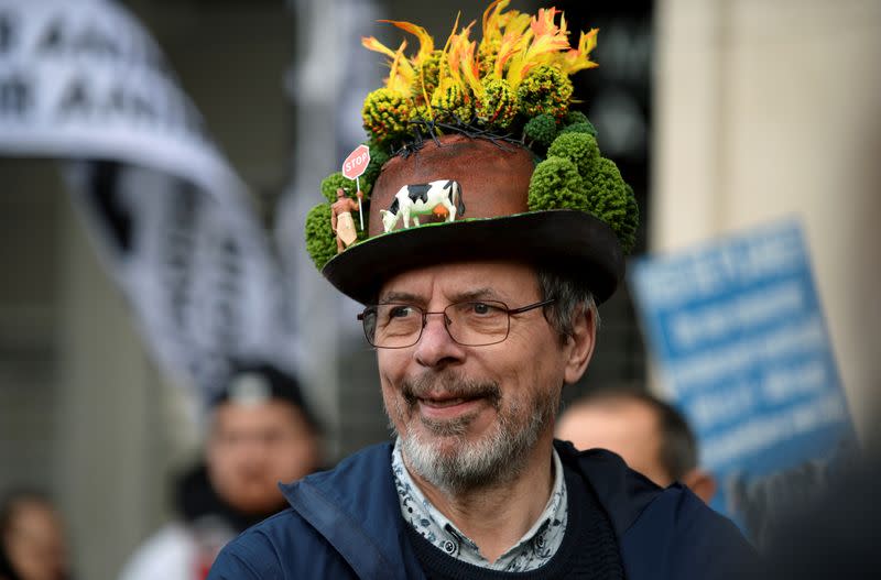 A man attends a climate change protest in Brussels