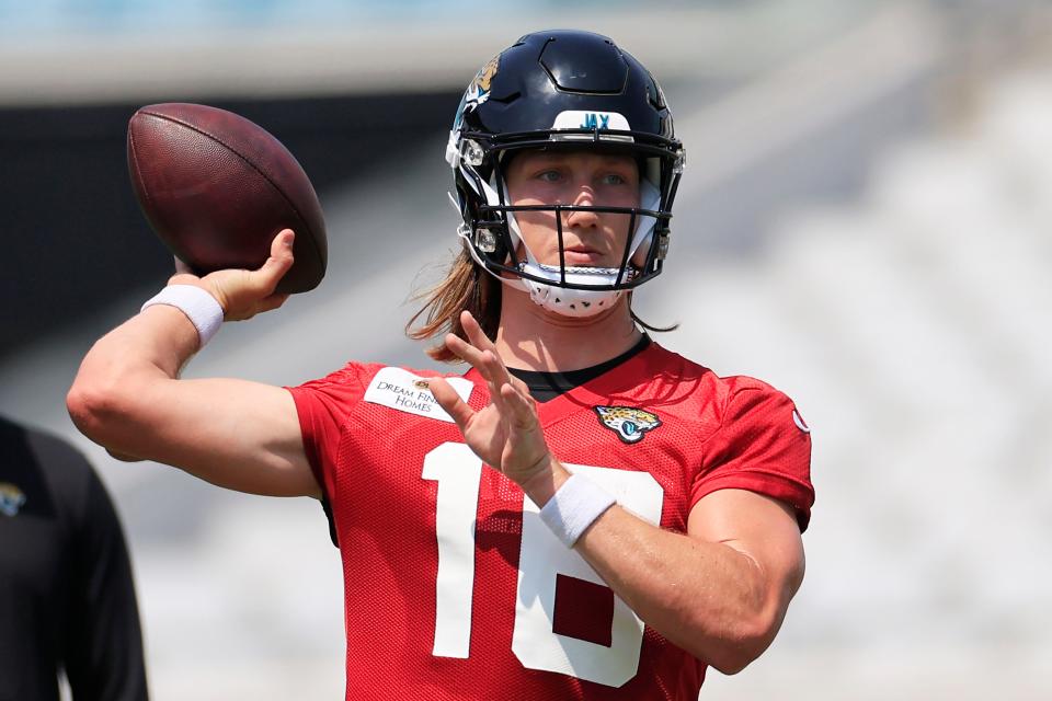 Jaguars quarterback Trevor Lawrence (16) looks to pass during organized team activities.