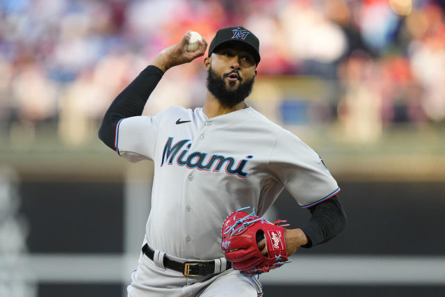 Miami Marlins' Jean Segura runs to beat the throw by Philadelphia Phillies  second baseman Bryson Stott but is out at the plate during the eighth  inning of a baseball game, Sunday, July