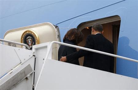 U.S. President Barack Obama and first lady Michelle Obama depart Joint Base Andrews aboard Air Force One in Washington en route to Johannesburg December 9, 2013. REUTERS/Kevin Lamarque