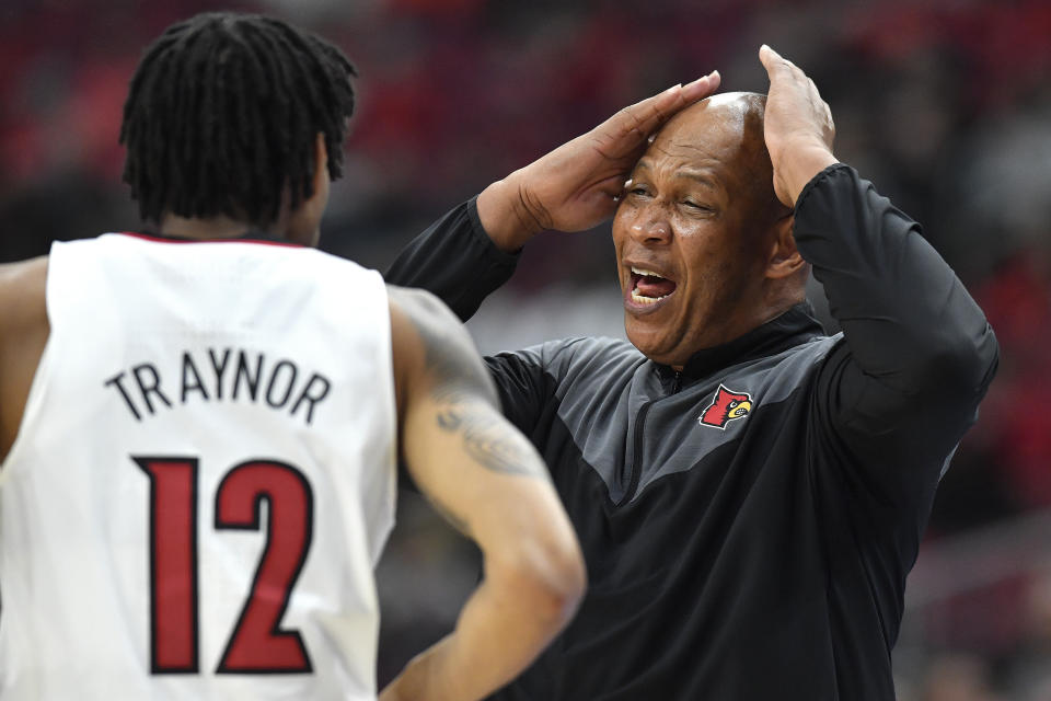 Louisville head coach Kenny Payne reacts to forward JJ Traynor (12) during the first half of an NCAA college basketball game in Louisville, Ky., Tuesday, Jan. 3, 2023. Syracuse won 70-69. (AP Photo/Timothy D. Easley)