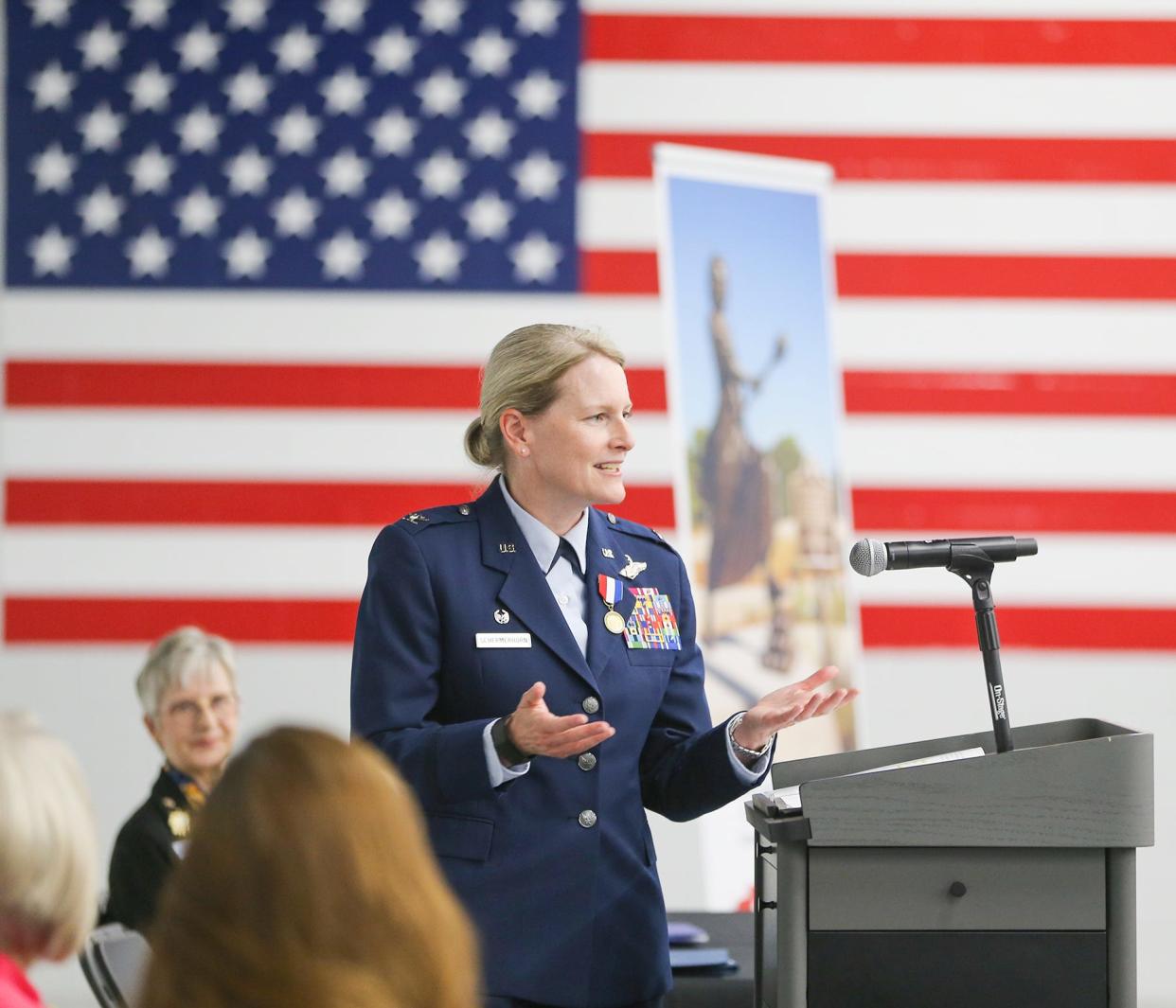 Col. Jocelyn Schermerhorn, the first female commander of the 1st Special Operations Wing at Hurlburt Field, speaks Monday after being presented with the Women In American History Medal by the Choctawhatchee Bay Chapter of the National Society of the Daughters of the American Revolution.