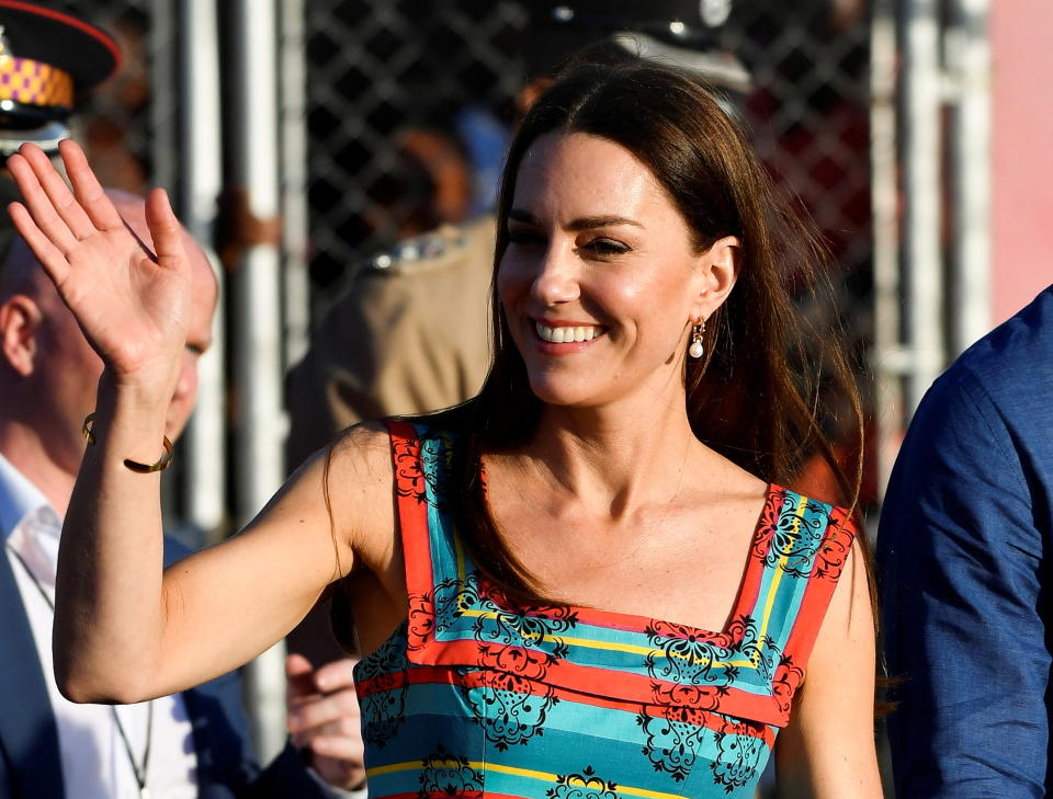 Kate, Princess of Wales, waves during her visit to Trench Town on the fourth day of her tour of the Caribbean, in Kingston, Jamaica, March 22, 2022. (REUTERS)