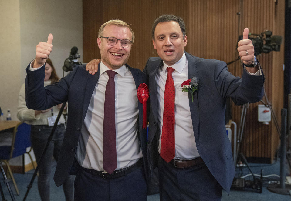 Scottish Labour leader Anas Sarwar, right, with candidate Michael Shanks after Labour won the Rutherglen and Hamilton West by-election, at South Lanarkshire Council Headquarters in Hamilton, Friday Oct. 6, 2023. The seat was vacated after former SNP MP Margaret Ferrier was ousted in a recall petition. Ferrier was kicked out of the SNP for breaching Covid regulations by travelling between London and Glasgow after testing positive for the virus. (Jane Barlow/PA via AP)